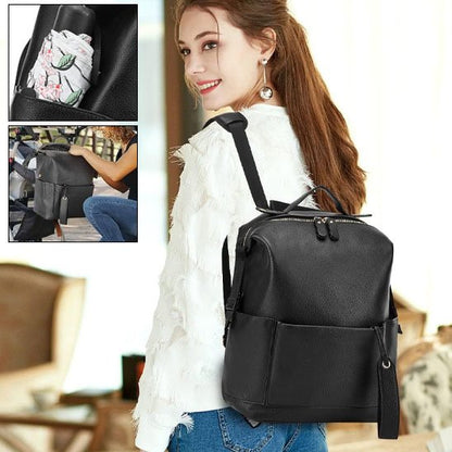 Sac à langer sac à dos noir pour bébé avec bretelles rembourrées et attaches poussette.